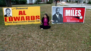 Houston, TX, February 2010. The blogger, sandwiched between Edwards and Miles signs.