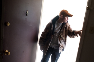 Cameron Maedgen enters his apartment in San Angelo. Maedgen, an autistic, brain-damaged, 19-year-old, is ineligible for state services because his IQ is too high — but too low-functioning to live without assistance.
