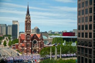 An estimated 25,000 demonstrators march past the Cathedral Shrine of the Virgin of Guadalupe in downtown Dallas.