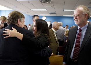 Attorneys representing Texas school districts congratulated each other after a judge ruled on Feb. 4, 2013, that the state's school finance system was unconstitutional.