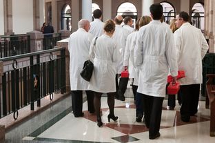 A group of medical doctors in the hallway of the Capitol extension on Feb. 8, 2013.