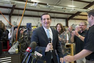 U.S. Sen Ted Cruz is welcomed at LaRue Tactical, a gun manufacturer in Leander, by founders Ellen LaRue, center, and Mark LaRue, right, on Feb. 19, 2013.