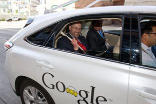 Texas Department of Transportation Executive Director Phil Wilson gets a ride in a Google self-driving car on Feb. 19, 2013, in front of the Hilton Austin.
