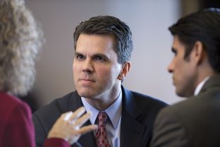 State Rep. Mark Strama, D-Austin, talks with colleagues in the Texas House on Feb. 13, 2013. Strama announced that he's not seeking re-election next term.