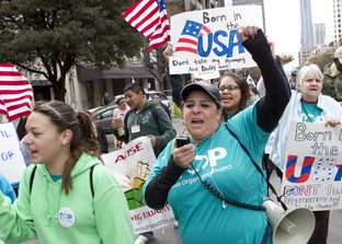 Large group for immigration reform, walks up Congress Ave. towards the Texas Capitol on February 22nd, 2013