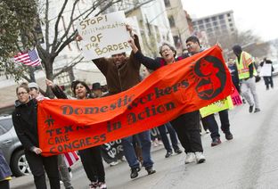 Large group for immigration reform rallies down Congress Ave. towards the Texas Capitol on February 22nd, 2013