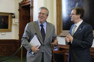 Education consultant and former Florida Gov. Jeb Bush, l, visits with Sen. Dan Patrick, R-Houston, before the Senate Education Committee on Feb. 27, 2013.