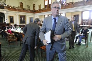 Jeb Bush leaves the Senate Education Committee after making a presentation on Florida education on Feb. 27, 2013.