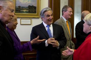 UT System Chancellor Francisco Cigarroa shakes hands with visitors at a Senate reception on Mar. 5, 2013.