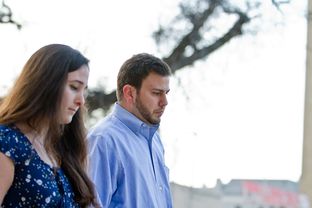 Eric Olson, who was 3 when his mother Christine Morton was murdered in 1986, enters the Tom Green County Courthouse with his wife Maggie Olson for the trial of Mark Alan Norwood on Tuesday, March 19, 2013.