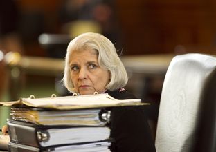 Sen. Judith Zaffirini D-Laredo, peeks over stack of binders at her desk during discussion of budget bill SB1 on March 20th, 2013