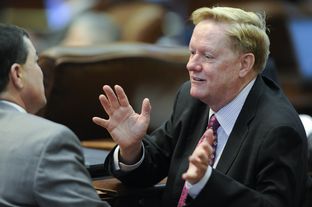 State Rep. Jim Pitts, R-Waxahachie, talks about HB 1 to a colleague on April 3, 2013.
