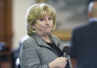 Sen. Jane Nelson, R-Flower Mound, grimaces as she lays out her CPRIT reform bill in the Senate on April 3, 2013.