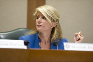 Sen. Wendy Davis, D-Fort Worth, listens after questioning Chairman Dan Patrick, R-Houston, on SB 23 in Senate Education Committee April 9, 2013.
