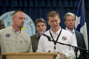 Chief of DPS Emergency Management Nim Kidd, r, answers a question on the West, TX explosion on April 18, 2013. Left to right are TCEQ head Zac Covar, Gov. Rick Perry, Kidd and Lt. Gov. David Dewhurst.