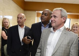 Senators John Whitmire, D-Houston, left, and Rodney Ellis, D-Houston, congratulate Michael Morton, right, at a court hearing in Georgetown on April 19, 2013. That day, a judge issued an arrest warrant for former Williamson County District Attorney Ken Anderson, after finding probable cause to believe Anderson withheld critical evidence in Michael Morton's 1987 murder trial.