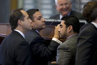 State Rep. Jason Villalba, R-Dallas, looks at Rep. Armando Walle, D-Houston, after Walle raised a point of order on HB 1009 on May 4, 2013. The bill creating a school marshal program later passed to third reading.