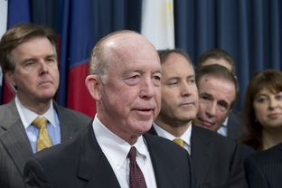 Surrounded by several Texas legislators, Dr. Steve Hotze announces his lawsuit targeting the Affordable Care Act on May 7, 2013.
