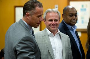 Michael Morton, at the Williamson County Courthouse on April 19, 2013, stands with state Sen. Rodney Ellis, D-Houston, an author of the Senate Bill 1611, and Ellis' chief of staff, Brandon Dudley, who also worked on the legislation.