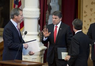 Gov. Rick Perry, c, talks with Lt. Gov. David Dewhurst and House Speaker Joe Straus after a military memorial ceremony in the Texas House chamber on May 25, 2013.