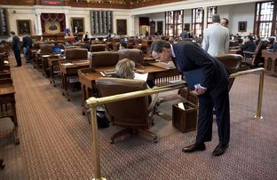 House Speaker Joe Straus speaks with State Rep. Stephanie Klick, R-Fort Worth, as the chamber awaits word of a special session mid-afternoon on May 27, 2013.