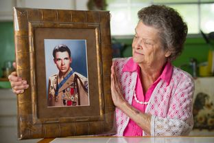 Nadene Lokey with a photo of her brother, WWII hero Audie Murphy, at her home in Farmersville, Texas on June 17, 2013.