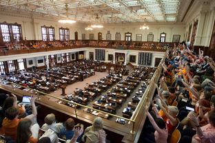 A packed Texas House gallery, filled mostly with the pro-choice group "Stand with Texas Women," cheer during a speech by Rep. Jessica Farrar D-Houston on June 23rd, 2013