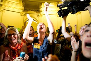 Cecile Richards, president of the Planned Parenthood Federation of America, cheering with activists to disrupt the last minutes of the vote on Senate Bill 5.