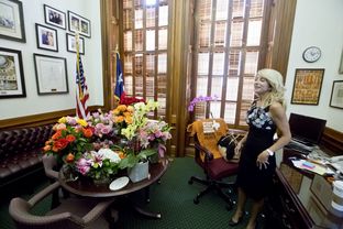 State Sen. Wendy Davis, D-Fort Worth, in her office on June 27, 2013, with flowers from supporters after her filibuster of an abortion bill.