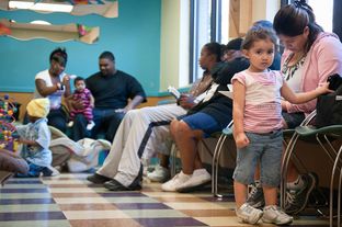 Patients wait to be seen at the People's Community Clinic in Austin, on Nov. 8, 2010.