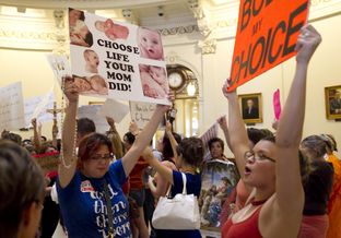 Citizens on both sides of the abortion debate crowd the Capitol rotunda as Senators debate the bill inside the chamber on July 12th, 2013.