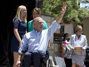 Attorney General Greg Abbott enters LaVillita with his wife Cecelia and daughter Audrey as he announced for Texas governor on July 14, 2013.