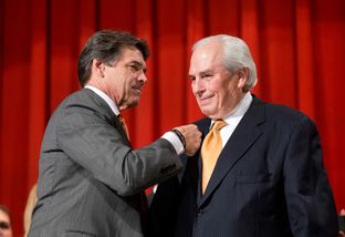 Gov. Rick Perry and Gene Powell at the signing of a merger bill between UT-Pan American and UT-Brownsville on July 16, 2013.