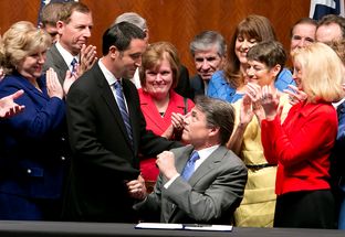Gov. Rick Perry, who signed House Bill 2 on Thursday, shakes hands with Sen. Glenn Hegar, R-Katy, the Senate sponsor of the omnibus abortion legislation.