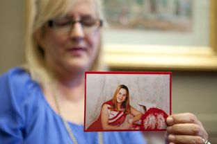 Laurie Griffin holds a photograph of her daughter Courtney outside the offices of state Rep. Elliott Naishtat on July 23, 2013. Griffin's daughter was killed by a driver who left the scene of the 2011 accident. Griffin has worked with Naishtat to pass news laws in Texas regarding certain hit-and-run cases.