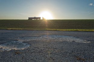 A damaged portion of the IH 37 frontage road, south of FM 99 in Live Oak County, Texas on Friday, August 16, 2013. The road is on a list of roads that the Texas Department of Transportation has announced will be converted to gravel because the agency lacks funds to keep them maintained at a safe level.