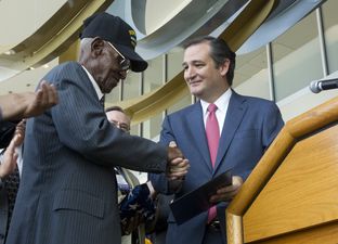 World War II veteran Richard Overton of Austin, 107, accepts an American flag flown over the U.S. Capitol from U.S. Sen. Ted Cruz on Aug. 22, 2013.