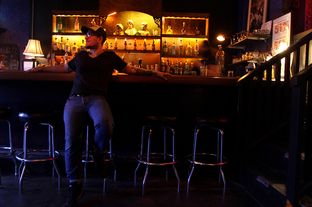 Alfred Campos waits for the Monday night karoake crowd to trickle in to his bar Monarch in El Paso, Texas.