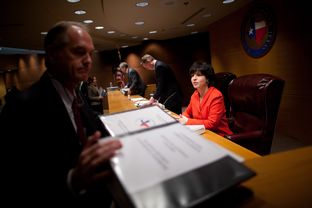 Railroad Commissioners Barry Smitherman (center), David Porter (left) and Christi Craddick (right) are shown at a Jan. 15, 2013, meeting in Austin.