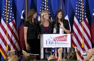 State Sen. Wendy Davis and her daughters during her announcement of her run for governor on Oct. 3, 2013.