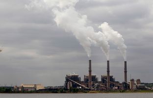 Steam rises from the stacks at the Martin Lake Coal-Fired Power Plant in Tatum, TX March 30, 2011.