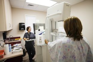 X-Ray Technologist Donna Fehl, prepares to scan a patient on a mobile mammogram machine at a clinic in Port Arthur, Texas, Monday, November 11, 2013.