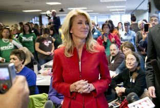 State Sen. Wendy Davis, D-Fort Worth, greeting supporters at a phone bank in Austin.