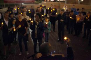 Minister Freedom Gulley led a candlelight vigil in recognition of World AIDS Day on Dec. 1, 2013, in Houston.