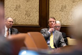 Embattled University of Texas at Austin President Billl Powers listens to a report during the University of Texas System Board of Regents meeting on Feb. 14, 2013.