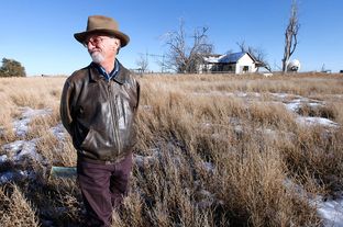Mike Skinner on Dec. 26, 2013 outside the farmhouse on the land five miles east of Spearman that he sold last spring. Three generations of his family had farmed the land.