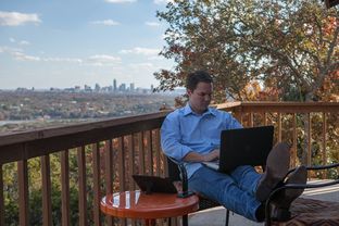W. Corbin Casteel, President of Four One Three Communications and political consultant, works from his home office in west Austin on December 18, 2013.