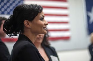 Katrina Pierson stands observing the crowd during a candidate forum for Texas Senate candidates held at the Churchill Recreation Center in Dallas, TX, on Tuesday, January 14, 2014.