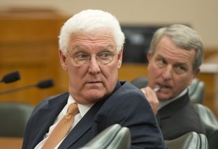 John Specia (left), the commissioner of the Texas Department of Family and Protective Services, and Health and Human Services Executive Commissioner Kyle Janek testify Feb. 20, 2014, at a Senate Health and Human Services Committee hearing.