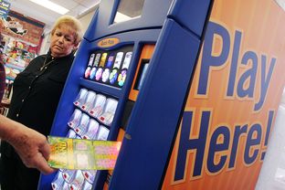 Dawn Nettles, who runs the lottery watchdog website lottoreport.com, stands by a scratch-off display in Mesquite.